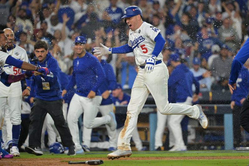LOS ANGELES – The best player perhaps in the history of the game had his latest Greatest Game Ever in Game 3 of the World Series.
A Dodger legend from a different time, who reached the heights of his profession but also plumbed the depths of playoff misery, saved them in the most gut-wrenching, close-your-eyes, no-not-him fashion imaginable.
The last men on the Toronto Blue Jays’ and Dodgers’ pitching staffs were charged with pitching until tomorrow – or at least long enough for their team to score – and one of them pulled it off.
Gather all those elements, mix them in a diabolical stew only baseball could concoct and the Dodgers and Blue Jays played to a standoff into the 18th inning, until finally, Freddie Freeman saved the Dodgers, with a walk-off home run to dead center field, sending Dodger Stadium into exhausted relief and ending a 6-5 L.A. victory that equaled the longest World Series clash by inning, and second-longest by time.
This epic lasted 6 hours, 39 minutes, long enough to contain several games within the game.
Consider this one: After Shohei Ohtani’s game-tying home run in the seventh inning, the teams played more than an entire scoreless game – 10 innings of spotless relief work from both pitching staffs.
The only other World Series game longer than this came on these same grounds, same circumstances, nearly seven years to the day: World Series Game 3, lasting 7 hours, 20 minutes until Max Muncy ended it with an 18th-inning solo home run off the Boston Red Sox’s Nathan Eovaldi.
Muncy is still a Dodger, and he nearly did it again, crushing a 14th-inning pitch from Blue Jays reliever Eric Lauer just wide of the foul pole in right field. That merely delayed the Blue Jays’ execution and allowed a window for Freeman’s heroics. 
And the walk-off histrionics that followed were as much relief as release.
Sure, there’s plenty of time left in this best-of-seven donnybrook. Yet in taking a 2-1 Series lead, the Dodgers tipped the scales significantly by claiming this 50-50 game in which both teams exhausted significant pitching equity to stay in this fight.
Beyond starting pitchers Ohtani and Shane Bieber, who will be available for Game 4 some 19 hours later? Don’t ask that just yet.
No, when pitching staffs have to cover 18 innings in one game, all bets are off for the remainder of the series. Need visual proof? Yes, that was Yoshinobu Yamamoto, who threw every pitch for the Dodgers in Game 2 just two days ago, getting loose in the 17th and 18th innings. And yes, that was Shane Bieber, slated to start Game 4 later Oct. 28, doing the same for the Blue Jays.
In this stemwinder of a game, both teams took leads of multiple runs but also forged game-tying rallies in regulation, the last coming on Ohtani’s game-tying, seventh-inning home run.
His blast to left center field induced the forever baseball that followed, but it was a greater pivot point for the entire series: Ohtani may never get another pitch to hit.
The first half of Ohtani’s night: Double, home run, double, home run. That second home run came after Blue Jays pitching coach Pete Walker came to the mound in the seventh and held a lengthy conversation with reliever Seranthony Dominguez, likely imparting sage advice such as ‘be careful.’
And then Dominguez piped a first-pitch fastball that Ohtani destroyed for his second homer, bringing us to the second half of Ohtani’s night:
Walk, intentional walk, intentional walk, intentional walk, intentional walk, walk – the four free passes a postseason record. 
Yep, Ohtani reached base nine times in nine plate appearances, but the Dodgers could not cash him in once Toronto manager John Schneider decided to take the bat out of his hand, perhaps for good.
‘Again, man, the guy’s a great player,’ Schneider said, maintaining his upbeat mien in his postgame press conference. ‘There’s certain times where I feel like you feel like, you feel better about someone else beating you.
‘If that someone else is Mookie Betts or Freddie Freeman it still stings.’
Meanwhile, Blue Jays lefty reliever Lauer and Dodgers right-hander Will Klein — the latter most certainly the last man on the Dodgers’ playoff roster — pitched 4 ⅔ and four innings, respectively, of scoreless relief.
Incredibly, they weren’t the game’s most unlikely pitching hero. No, that honor went to a slam-dunk Hall of Famer.
Clayton Kershaw, expected to fulfill a role as long man in the bullpen and hoping perhaps for a final courtesy appearance before the home crowd at Dodger Stadium, entered the game in the gnarliest possible position: Top of the 12th, two outs, bases loaded and the Blue Jays 90 feet away from taking the lead.
Facing Nathan Lukes in a left-on-left situation, the man whose fastball once crackled in the upper 90s and whose curveball Vin Scully once dubbed “Public Enemy No. 1,” decided if he’d go down, it would be almost exclusively with the last functioning tool in his kit.
So, he threw Lukes eight sliders in nine pitches, the last inducing a soft groundball to second base, to end the inning and keep the Dodgers level.
That was just one of the Blue Jays’ points of extreme frustration in the late innings.
In the eighth, ninth, 10th, 12th and 18th innings they put the tying run in scoring position but failed to bring him home. Most aggravating: Pinch-runner Davis Schneider was thrown out at the plate after Lukes’ double in the 10th, a moment that may be rued even more once the very long winter arrives in Ontario.
Oh, we mentioned the greatest player in the game, right?
Yeah, several innings before the extra-innings drama, Ohtani set a Dodgers World Series record with 12 total bases. He’d never swing the bat again on this night, perhaps not in the final few games of this series.
But the patience was worth it. The Dodgers are halfway to a second consecutive World Series title, even if they had to work double time to get there.
Freeman won Game 1 here last year with a walk-off 10th-inning grand slam, against the New York Yankees. The Dodgers never looked back.
This smash, off Blue Jays lefty Brendon Little, may have the same effect. 
<em>Here’s how Game 3 unfolded in Los Angeles:</em>
<a></a> Longest World Series game ever: Dodgers-Blue Jays ties the record
Brendon Little got Mookie Betts to pop out with runners on first and second to end the bottom of the 17th and send this to the 18th inning, tying the record for longest game in World Series history.
<a></a> 17 innings! World Series getting weirder
World Series Game 3 is going to the 17th inning at Dodger Stadium after Teoscar Hernandez brought the crowd to its feet with a long fly ball that died just short of the center field wall. Eric Lauer has now tossed 4 ⅔ scoreless innings in relief for the Blue Jays.
<a></a> To the 16th: Dodgers 5, Blue Jays 5
Blue Jays lefty Eric Lauer has completed 3.2 scoreless innings, retiring Mookie Betts and Freddie Freeman to end the bottom of the 15th.
<a></a> Shohei Ohtani sets record with fourth intentional walk
Shohei Ohtani has set another record with four intentional walks in the game after getting a free pass from Lauer in the bottom of the 15th.
Dodgers vs Blue Jays among longest World Series games in history
The Los Angeles Dodgers and Toronto Blue Jays are making history in Game 3 of the World Series, just the second time that a Fall Classic game has gone to 15 innings.
The longest game in World Series history took place in 2018, when the Dodgers beat the Boston Red Sox on Max Muncy’s home run in the 18th inning of Game 3 right here at Dodger Stadium. Prior to the 2018 record-setting affair, the longest World Series game was 14 innings, happening in 1916, 2005 and 2015.
<strong>18 innings</strong>: 2018 World Series, Game 3
<strong>15 innings</strong>: 2025 World Series, Game 3
<strong>14 innings</strong>: 2015 World Series, Game 1
<strong>14 innings</strong>: 2005 World Series, Game 3
<strong>14 innings</strong>: 1916 World Series, Game 2
<a></a> Dodgers fail to win it in the 13th inning
Tommy Edman led off the bottom of the 13th with a double and moved to third on a sacrifice bunt, but the Dodgers were unable to plate the winning run, with Freddie Freeman ultimately flying out to the warning track in center field with the bases loaded.
The Dodgers are 2-for-11 with runners in scoring position tonight.
<a></a> Clayton Kershaw escapes bases-loaded jam in 12th
Emmet Sheehan loaded the bases in the top of the 12th and Dodgers manager Dave Roberts brought in Clayton Kershaw to face left-hander Nathan Lukes. On the eighth pitch of the at-bat, Kershaw got Lukes to hit a soft grounder to second baseman Tommy Edman, who had to make a glove flip to Freddie Freeman for the final out.
<a></a> Shohei Ohtani intentionally walked again
Braydon Fisher intentionally walked Shohei Ohtani with two outs and the bases empty in the bottom of the 11th and then Mookie Betts singled, but Freddie Freeman flew out to left to strand the winning run on second.
<a></a> Emmet Sheehan scoreless in the 11th
Emmet Sheehan retired the Blue Jays in order in the top of the 11th to finish off his second scoreless innings and send the game to the bottom of the frame still tied 5-5.
<a></a> To the 11th: Dodgers 5, Blue Jays 5
Jeff Hoffman worked out of a jam in the bottom of the 10th, getting Tommy Edman to pop out with runners on second and third. Hoffman had hit Will Smith and gave up a single to Teoscar Hernandez
Longest MLB playoff games
Game 3, 2022 ALDS (18 innings): Astros 1, Mariners 0
Game 3, 2018 World Series (18 innings): Dodgers 3, Red Sox 2
Game 2, 2014 NLDS (18 innings): Giants 2, Nationals 1
Game 4, 2005 NLDS (18 innings): Astros 7, Braves 6
Game 6, 1986 NLCS (16 innings): Mets 7, Astros 6
Game 5, 2025 ALDS (15 innings): Mariners 3, Tigers 2
Game 2, 2022 ALWC (15 innings): Guardians 1, Rays 0
Game 5, 1999 NLCS (15 innings): Mets 4, Braves 3
Game 2, 1995 ALDS (15 innings): Yankees 7, Mariners 5
Game 1, 2015 World Series (14 innings): Royals 5, Mets 4
Game 2, 2015 ALDS (14 innings): Rangers 6, Blue Jays 4
Game 3, 2005 World Series (14 innings): White Sox 7, Astros 5
Game 5, 2004 ALCS (14 innings): Red Sox 5, Yankees 4
Game 2, 1916 World Series (14 innings): Red Sox 2, Robins (Dodgers) 1
<a></a> Dodgers cut down go-ahead run in the 10tth
Davis Schneider was thrown out at the plate to the end the top of the 10th trying to score from first on Nathan Lukes’ double into the right field corner. Teoscar Hernandez got the ball to Tommy Edman, who delivered a picture-perfect relay throw to Will Smith to get Schneider.
Could not draw that up any better defensively.
<a></a> What’s the most innings in a World Series game?
The Dodgers and Red Sox played an 18-inning game in the 2018 World Series, the longest in Fall Classic history.
<a></a> Extra innings in World Series Game 3!
Jeff Hoffman intentionally walked Shohei Ohtani with the bases empty and one out in the bottom of the ninth, but the MVP-to-be was caught stealing second, unable to stay on the base after initially getting in ahead of the tag.
<a></a> Roki Sasaki escapes top of the ninth
<a></a> To the ninth: Blue Jays 5, Dodgers 5
With runners on second and third in the top of the eighth, Roki Sasaki came in to get the final out will come back on to start the top of the ninth, his first appearance in this World Series. Chris Bassitt pitched a scoreless eighth for the Blue Jays and now if the Dodgers are to notch a Game 3 win, it will be of the walk-off variety.
<a></a> Shohei Ohtani home run ties Game 3 in the seventh
LOS ANGELES – Shohei Ohtani is almost singlehandedly keeping the Dodgers afloat in World Series Game 3 as it heads toward a scintillating conclusion. 
Ohtani’s second home run of the night off Blue Jays reliever Seranthony Dominguez tied the score 4-4 in the bottom of the seventh inning at Dodger Stadium. 
It came with one out and the bases empty and trustworthy right-hander Dominguez on the mound. Just to make sure, pitching coach Pete Walker came out to consult with Dominguez and catcher Alejandro Kirk. 
The meeting had scarcely broken up when Ohtani jumped on Dominguez’s first pitch, a poorly located fastball, and directed it into the stands in left center field. 
Ohtani’s night? Double, homer, RBI double, game-tying homer. All he needs is another blast to straightaway center to baptize every corner of the Dodger Stadium outfield. 
Don’t put it past him. 
<a></a> Vladimir Guerrero Jr. sneaks in to put Blue Jays in front
LOS ANGELES – A dribbler down the first base line, a fortuitous bounce and one of the most unlikely trips around the bases pushed the Blue Jays into the lead heading to the bottom of the seventh inning of World Series Game 3. 
Bo Bichette knocked a two-out single off Blake Treinen into foul ground, where it kicked up off the oddly-angled side wall, nearly struck a Fox Sports sound man and dribbled back toward the infield. 
And Vladimir Guerrero, the Blue Jays’ franchise player, picked up his pace and chugged home ahead of Teoscar Hernández’s throw, sliding in awkwardly just ahead of the tag to give Toronto a 5-4 lead. 
George Springer comes out with injury
George Springer, Toronto’s designated hitter and leadoff man, winced and immediately walked toward the dugout after a seventh-inning swing as he faced Dodgers left-hander Justin Wrobleski. 
Springer, who has been playing through significant knee pain, clutched his left lower back after his swing, consulted briefly with manager John Schneider and a trainer and walked to the dugout. 
He was replaced by pinch-hitter Ty France, who struck out. 
<a></a> Ohtani and Freeman tie it up for Dodgers: 4-4 through five
LOS ANGELES – This time, there were no protestations from Max Scherzer. 
No ‘No!’ screamed at his manager, John Schneider. Just vigorous head nods, a look of capitulation and a seamless handing over of the baseball as Shohei Ohtani loomed at the plate, representing the tying run.
Yet the maniacally competitive Scherzer’s bullpen could not bail him out. 
Reliever Mason Fluharty hung a two-strike sweeper that Ohtani belted into the left field corner, trimming Toronto’s lead to one run. And then Freddie Freeman hooked a single inside the first base line, sending Ohtani home clapping his hands in joy as the Dodgers tied Game 3 of the World Series 4-4 after five innings.
As crisp as Scherzer often looked during much of his outing, the 41-year-old future Hall of Famer lost any chance at staying in the game when he gave up a leadoff single to No. 8 hitter Kiké Hernández. Going to the lefty Fluharty with one out and Ohtani up made total sense. 
Yet in a game in which both clubs have held the lead, it is now knotted up as the Dodgers reach into the nether reaches of their leaky bullpen and hope to live to tell about it. 
<a></a> Alejandro Kirk home run ambushes Tyler Glasnow
LOS ANGELES – The Blue Jays ambushed Dodgers right-hander Tyler Glasnow, and perhaps changed the complexion of this entire World Series in a four-batter span. 
Alejandro Kirk spanked a Glasnow first-pitch curveball over the wall in left center field for a three-run home run, erasing a two-run deficit as the Blue Jays took a 4-2 in the fourth inning of Game 3 of the World Series. 
Kirk, their typical clean-up hitter, was moved to the No. 6 hole with the return of Bo Bichette from injury. And after Vladimir Guerrero Jr. walked and Bichette reached on an error from second baseman Tommy Edman, Kirk sent the next pitch over the head of a leaping Andy Pages to take the lead. 
Toronto was not done peppering Glasnow, as Addison Barger and Ernie Clement contributed consecutive singles to set up a sacrifice fly from No. 9 hitter Andrés Giménez. With Glasnow’s pitch count drifting north of 60, it also enhanced the chances the Blue Jays get a crack at the Dodgers’ struggling bullpen. 
<a></a> Shohei Ohtani home run makes it 2-0 in the third
LOS ANGELES – WIth a vicious uppercut swing, Shohei Ohtani registered another body blow for the Dodgers in World Series Game 3. 
Ohtani ripped a Max Scherzer fastball skyward and into the Dodges’ bullpen in right field, their second home run in as many innings as they took a 2-0 lead after three innings of Game 3. 
While Ohtani is just 11-for-48 in these playoffs, he’s now homered in consecutive games. Despite his longball and Teoscar Hernández’s shot into the left field bullpen the previous inning, Scherzer, 41, has looked generally sharp, striking out three in three innings.
He was bailed out by right fielder Addison Barger, who threw out Freddie Freeman trying to score from second on Will Smith’s single to end the inning. 
<a></a> Teoscar Hernández home run puts Dodgers in front
LOS ANGELES – For the third time in as many games of this World Series, the Los Angeles Dodgers struck first. 
Teoscar Hernández ripped a Max Scherzer pitch into the Dodgers’ left field bullpen to give the Dodgers a 1-0 lead after two innings. 
Hernández’s homer was his eighth over the past two postseasons for the Dodgers, who dodged a second-inning threat but have also struck out three times against Scherzer.
<a></a> Max Scherzer works around Shohei Ohtani leadoff double
LOS ANGELES – Brad Paisley and Hideo Nomo exited stage right, and the Hall of Famers came out to play. 
A star-studded Game 3 of the World Series began with ear-splitting boos for Dodger nemesis George Springer, and the first inning ended with Blue Jays starter Max Scherzer stranding Shohei Ohtani on second base by striking out Will Sith on a full-count curveball. 
That rendered Ohtani’s leadoff double moot, as Mookie Betts flew out to right field, Freddie Freeman popped to third base and Scherzer, the 41-year-old who will enter Cooperstown five years after he decides to stomp around major league mounds, winning a seven-pitch battle with Smith. 
<a></a> Max Scherzer makes World Series history
Across his Hall of Fame career, Max Scherzer has been part of numerous pieces of MLB history.
That laundry list will continue when he takes the bump in the bottom of the first inning at Dodger Stadium in Game 3 of the 2025 World Series for the Toronto Blue Jays against the Los Angeles Dodgers: first pitcher in MLB history to pitch in the Fall Classic for four different franchises.
<a></a> Blue Jays’ George Springer booed to start Game 3
LOS ANGELES – George Springer has spent the past six seasons enduring a cacophony of boos whenever he plays a road game, lingering fallout from his role in the 2017 Houston Astros’ sign-stealing scandal, uncovered publicly in 2019.
Yet time, and place, and context matter so much and that’s why it hit very different – and a lot louder – Oct. 27 as Springer led off Game 3 of the World Series at Dodger Stadium.
<a></a> Blue Jays lineup today
George Springer (R) DH
Nathan Lukes (L) LF
Vladimir Guerrero Jr. (R) 1B
Bo Bichette (R) 2B
Daulton Varsho (L) CF
Alejandro Kirk (R) C
Addison Barger (L) RF
Ernie Clement (R) 3B
Andrés Giménez (L) SS
<a></a> Dodgers lineup today
Shohei Ohtani (L) DH
Mookie Betts (R) SS
Freddie Freeman (L) 1B
Will Smith (R) C
Max Muncy (L) 3B
Teoscar Hernández (R) RF
Tommy Edman (S) 2B
Enrique Hernández (R) LF
Andy Pages (R) CF
Max Scherzer and Clayton Kershaw, one last time
LOS ANGELES — “Max and I are definitely linked. We got to play together. And now I get to do this again,” says Clayton Kershaw, who was joined in the rotation by Scherzer at the 2021 trade deadline after a deal with Washington as the Dodgers won 106 games, but bowed out in the National League Championship Series.
“I think I’m too old, now. But Scherz can keep going. He’s doing great stuff, obviously. It’s fun to see us coming up together, being able to do this. It’s a lot of fun.”
For the better part of two decades, Kershaw and Scherzer were the ultimate alphas, Kershaw quietly doing a very good Sandy Koufax emulation over 18 seasons, Scherzer crafting a Mad Max persona that was backed up by utter dominance in every town he invaded. <em>— Gabe Lacques</em>
World Series schedule 2025
<strong>Game 1: Blue Jays 11, Dodgers 4</strong>
<strong>Game 2: Dodgers 5, Blue Jays 1</strong>
<strong>Game 3</strong>: Monday, Oct. 27 in Los Angeles – 8 p.m. ET, FOX
<strong>Game 4</strong>: Tuesday, Oct. 28 in Los Angeles – 8 p.m. ET, FOX
<strong>*Game 5</strong>: Wednesday, Oct. 29 in Los Angeles – 8 p.m. ET, FOX
<strong>*Game 6</strong>: Friday, Oct. 31 in Toronto – 8 p.m. ET, FOX
*<strong>Game 7</strong>: Saturday, Nov. 1 in Toronto – 8 p.m. ET, FOX
Los Angeles Dodgers World Series roster
<strong>Pitchers (12)</strong>: LHP Anthony Banda, LHP Jack Dreyer, RHP Tyler Glasnow, RHP Edgardo Henriquez, LHP Clayton Kershaw, RHP Will Klein, RHP Roki Sasaki, RHP Emmet Sheehan, LHP Blake Snell, RHP Blake Treinen, LHP Justin Wrobleski, RHP Yoshinobu Yamamoto.
<strong>Position, two-way players (14)</strong>: SS Mookie Betts, OF Alex Call, OF Justin Dean, INF/OF Tommy Edman, 1B Freddie Freeman, INF/OF Kiké Hernández, OF Teoscar Hernández, INF/OF Hyeseong Kim, 3B Max Muncy, DH/P Shohei Ohtani, OF Andy Pages, INF Miguel Rojas, C Ben Rortvedt, C Will Smith.
Toronto Blue Jays World Series roster
<strong>Pitchers (12):</strong> RHP Chris Bassitt, RHP Shane Bieber, RHP Seranthony Dominguez, RHP Braydon Fisher, LHP Mason Fluharty, RHP Kevin Gausman, RHP Jeff Hoffman, LHP Eric Lauer, LHP Brendon Little, RHP Max Scherzer, RHP Louis Varland, RHP Trey Yesavage.
<strong>Position players (14):</strong> C Tyler Heineman, C Alejandro Kirk, INF/OF Addison Barger, INF Bo Bichette, INF Ernie Clement, INF Ty France, INF Andrés Giménez, INF Vladimir Guerrero Jr., INF Isiah Kiner-Falefa, OF Nathan Lukes, OF Davis Schneider, OF George Springer, OF Myles Straw, OF Daulton Varsho.
World Series umpires for Game 3
<strong>Home plate</strong>: Mark Wegner (crew chief)
<strong>First base</strong>: Alan Porter
<strong>Second base</strong>: Adam Hamari
<strong>Third base</strong>: Jordan Baker
<strong>Left field</strong>: Will Little
<strong>Right field</strong>: Adrian Johnson
<strong>Reserve</strong>: John Tumpane
World Series national anthem for Game 3
On Oct. 27, country singer Brad Paisley will perform the national anthem at the 2025 World Series.
The Nashville star will hit the field before Game 3 at Dodger Stadium in Los Angeles between the Toronto Blue Jays And Dodgers. The two teams split the first two games in Toronto. <em>— Audrey Gibbs, Nashville Tennessean</em>
World Series announcers on Fox
Joe Davis, play-by-play
John Smoltz, color commentary
Ken Rosenthal and Tom Verducci, dugout reporters
World Series winners by year
<strong>2024</strong>: Dodgers
<strong>2023</strong>: Rangers
<strong>2022</strong>: Astros
<strong>2021</strong>: Braves
<strong>2020</strong>: Dodgers
<strong>2019</strong>: Nationals
<strong>2018</strong>: Red Sox
<strong>2017</strong>: Astros
<strong>2016</strong>: Cubs
<strong>2015</strong>: Royals
<strong>2014</strong>: Giants
<strong>2013</strong>: Red Sox
<strong>2012</strong>: Giants
<strong>2011</strong>: Cardinals
<strong>2010</strong>: Giants
How many times have the Dodgers won the World Series?
The Dodgers have won eight World Series titles in franchise history – one in Brooklyn and seven in Los Angeles
1955 vs. Yankees
1959 vs. White Sox
1963 vs. Yankees
1965 vs. Twins
1981 vs. Yankees
1988 vs. Athletics
2020 vs. Rays
2024 vs. Yankees
<a></a> What time is the Dodgers game today Pacific Time?
Game 3 of the World Series begins at 5 p.m. Pacific Time.
Blue Jays World Series appearances
Toronto won back-to-back World Series championships in 1992 (vs. Braves) and 1993 (vs. Phillies), the only times in franchise history the club has reached the Fall Classic since coming into existence in 1977.
When did the Dodgers move to LA?
The Dodgers left Brooklyn after the 1957 season, playing their first game in Los Angeles in 1958.
The New York Giants departed for San Francisco at the same time, bringing the NYC rivalry to the West Coast.
Did Vladimir Guerrero win a World Series?
Hall of Famer Vladimir Guerrero never won a World Series title, making his only Fall Classic appearance for the Texas Rangers in 2010, the penultimate of his 16-year MLB career.
<a></a> How tall is Alejandro Kirk?
Toronto catcher Alejandro Kirk is 5-foot-8.
<a></a> What time is World Series? Dodgers vs Blue Jays Game 3 today
Monday’s game is scheduled to begin at<strong> 8 p.m. ET</strong> at Dodger Stadium.
This post appeared first on USA TODAY Walk-off home run ends longest World Series game in MLB history